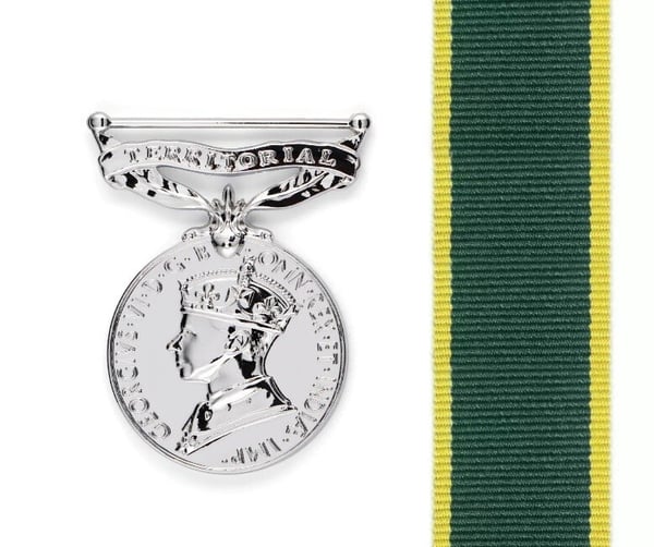 A close-up of a medal
Description automatically generated