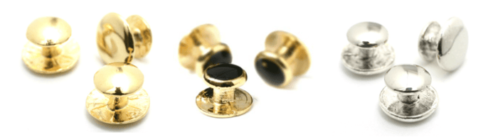 A close-up of a pair of gold buttons
Description automatically generated