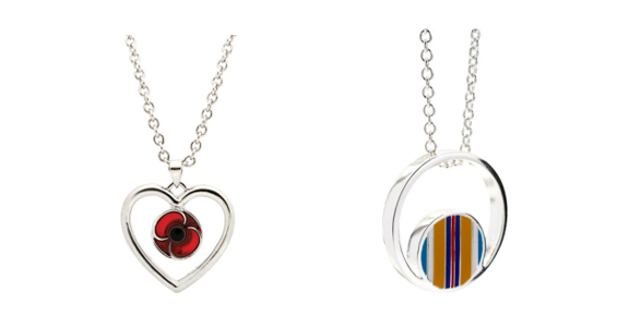 A couple of necklaces with a red eye and a blue circle
Description automatically generated