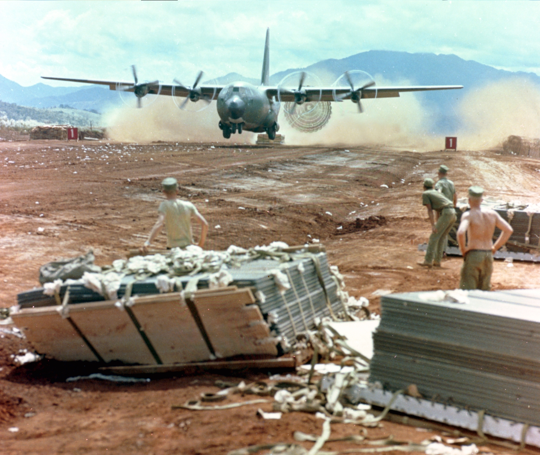 Caption: an allied C130 Hercules air drop during the Vietnam War.