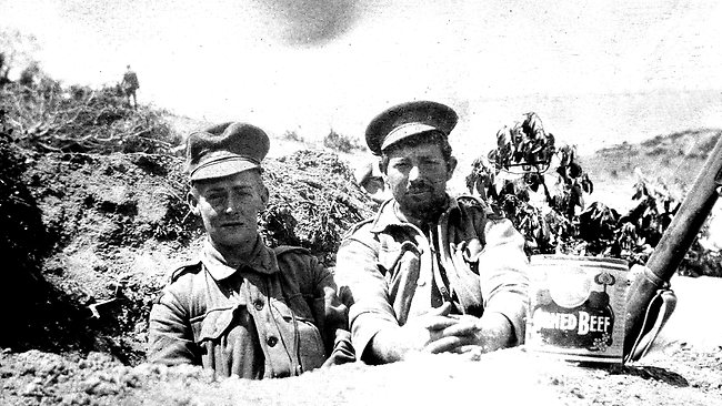 A belt-filling shelter at Gallipoli. Lance Corporal Barker, left, and Private G. Hill, with a tin of bully beef.