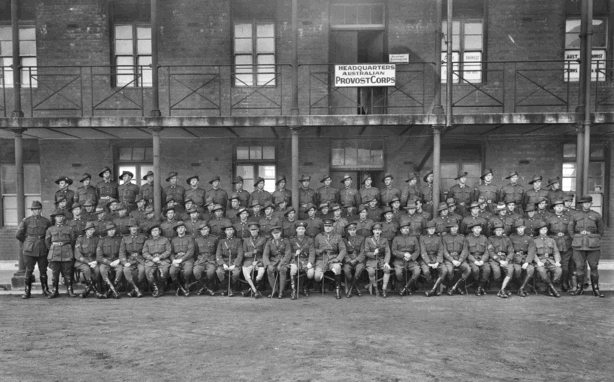 Group portrait of unidentified members of Headquarters of the Anzac Provost Corps, at Bhurtpore Barracks.