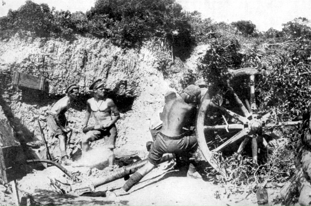 An 18 pound field gun in action during a Turkish attack at Gallipoli. They are firing from McCay's Hill towards the Olive Grove.