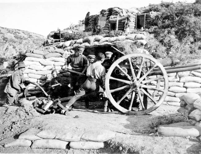 Image: Members of the 9th Battery, 3rd Field Artillery Brigade, First Division, AIF, loading and firing their 18-pounder gun.